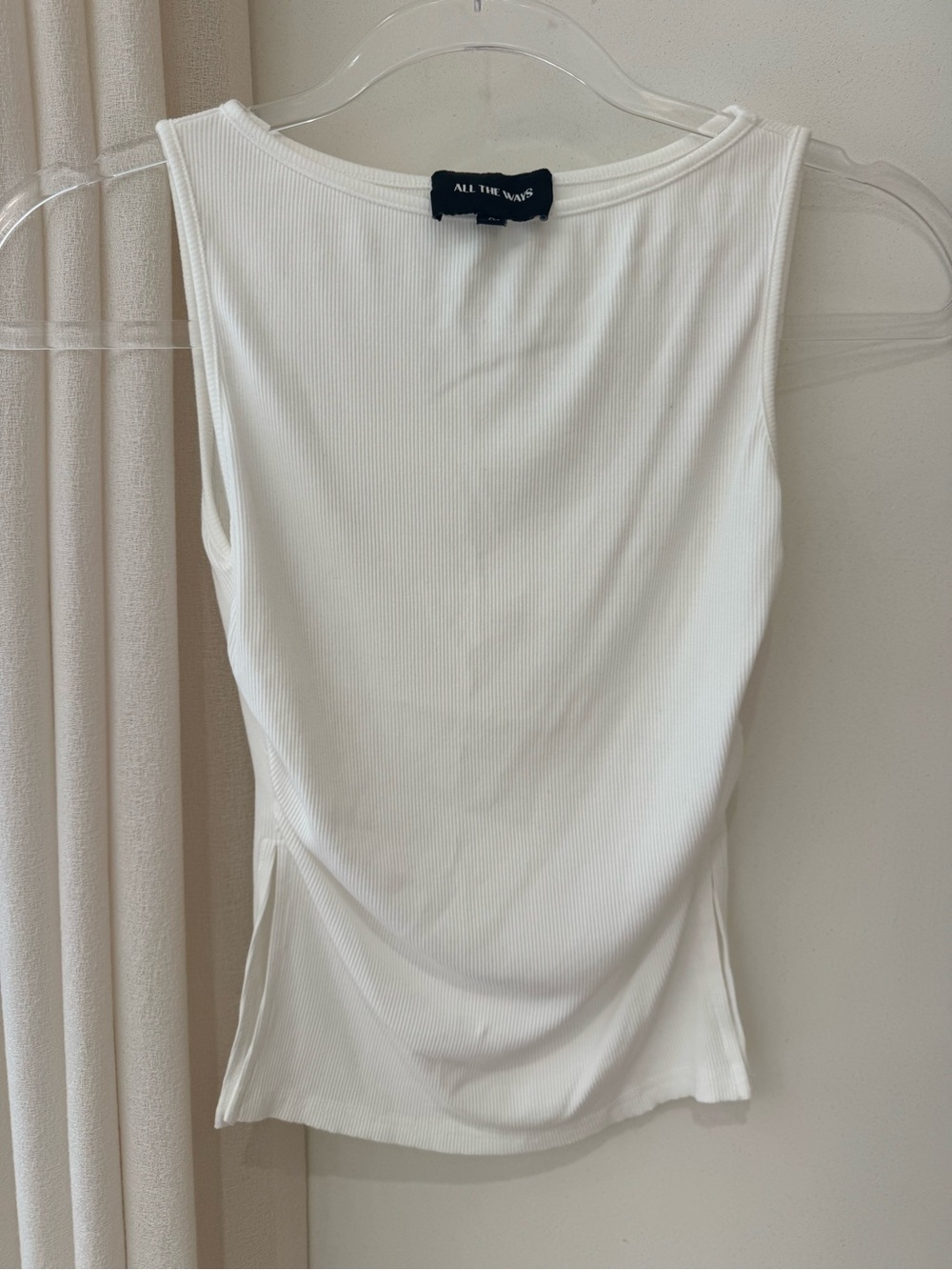 All the Ways white ribbed tee shirt.